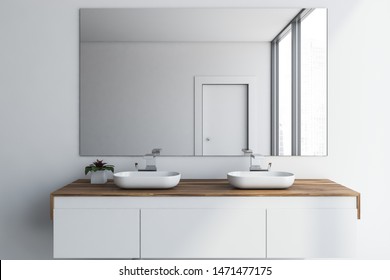 Close Up Of Double Bathroom Sink Standing On White And Wooden Countertop In Room With White Walls And Large Mirror. 3d Rendering