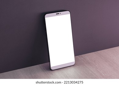 Close up of empty white cellphone on dark wall and wooden surface background. Mobile app concept. 3D Rendering