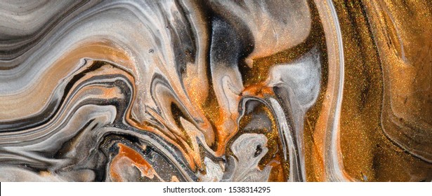 Close Up Of Golden Metallic Acrylic Paint In A Thick Swirl. Sparkles In The Paint Give An Extra Glow. Macro Detail Photo Of My Acrylic Pouring Work. 