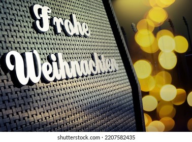 Close Up Of A Guitar Amp With German Merry Christmas Badge And Blurred Christmas Lights, Blurred Guitars In The Background, 3d Rendering