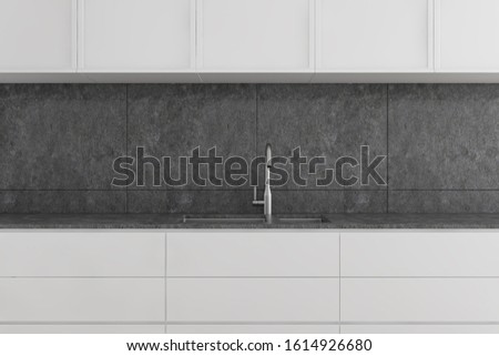 Close up of kitchen sink built in white countertops with cupboards above it in modern room with concrete walls. 3d rendering