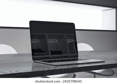 Close up of laptop screen with reflections on wooden office desk. Workplace and technology concept. 3D Rendering