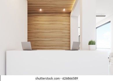 Close Up Of A Reception Desk Standing In An Office With Light Wooden Wall Elements. 3d Rendering, Mock Up