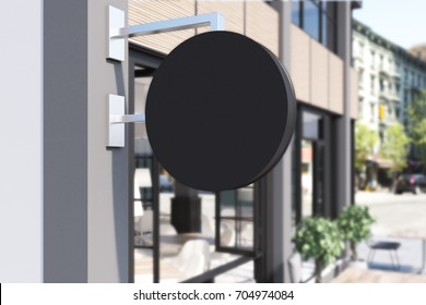 Close Up Of A Round Blank Cafe Sign. Beige And Gray Facade, A Blurred Street In The Background. 3d Rendering Mock Up