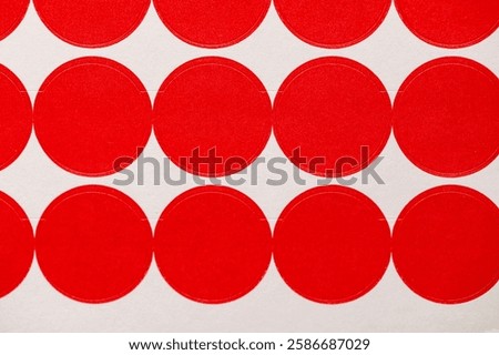 close up of sheet of red circle, dot stickers