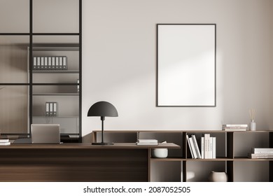 Close Up View On Bright Office Room Interior With Empty White Poster, Desk, Comfortable Armchair, Laptop, Lamp. Perfect Place For Working Process. Minimalist Design. Mock Up. 3d Rendering