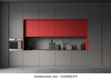 Close Up View On Dark Kitchen Room Interior With Cupboard, Gas Cooker, Grey And Red Wall, Sink, Liquid Soap, Oil, Oven And Concrete Floor. Concept Of Minimalist Design. 3d Rendering