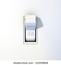 Close up of a wall light switch in the on position