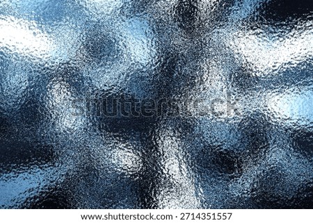 Closeup abstract background showcasing a rough, bumpy surface texture reminiscent of frosted glass, ice, or condensed moisture on a window pane The cool blue and white tones create a modern and icy