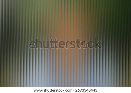 A close-up, abstract view of a textured surface, possibly glass, with a softly blurred human form visible behind it.