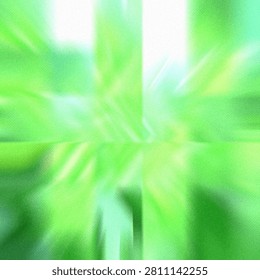 Close-up of blurred green leaves with intersecting light rays creating a serene, abstract natural effect.
