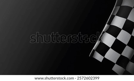 A close-up of the bottom corner of a checkered flag against a black background.
