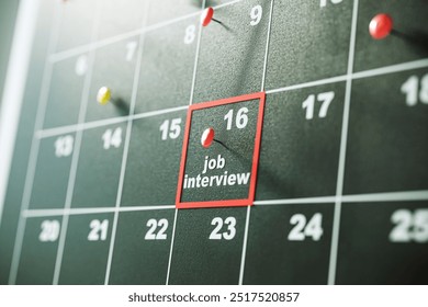 Closeup of a calendar with a red pin marking a job interview on the 16th. Black background. Concept of planning, scheduling, and reminders. 3D Rendering - Powered by Shutterstock