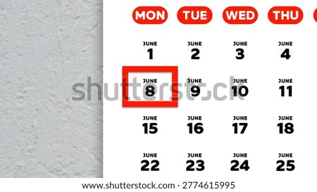 Close-up of the date June 8th marked with a red cursor on the wall calendar 2026