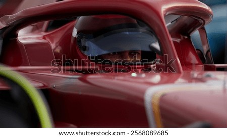 Close-up of a focused pilot driver in a red racing car, wearing a helmet, preparing for a high-speed race. Realistic 3d rendering. 3D Illustration