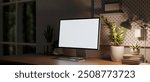 A close-up image of a computer with a white screen mockup on a wooden table in a dark room at night, illuminated by a table lamp, creating a cozy atmosphere. 3d render, 3d illustration