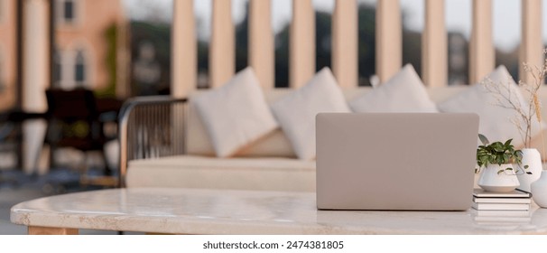 A close-up image of a laptop computer on a luxury neutral marble coffee table in a modern office lounge. place of work concept. 3d render, 3d illustration