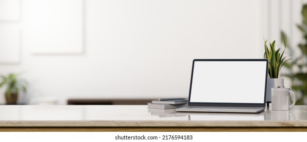 close-up image, Modern laptop computer mockup, book, coffee mug, decor plant and copy space on tabletop over blurred white living room in the background. 3d rendering, 3d illustration