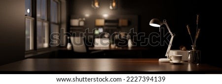 close-up image, Modern stylish dark workspace tabletop with table lamp, decor and copy space for display your product mockup over blurred modern dark office background. 3d render, 3d illustration 商業照片 © 