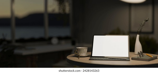 Close-up image of a white-screen digital tablet mockup on a round wooden table in a dark cosy living room at night. Home workspace concept. 3d render, 3d illustration