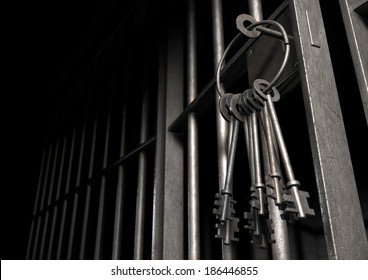A closeup of the lock of a  jail cell with iron bars and a bunch of key in the locking mechanism with the door open
