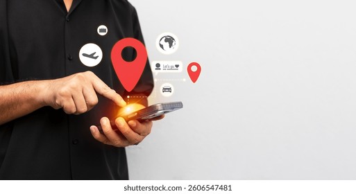 Close-up of a man using a smartphone with GPS and travel icons, representing navigation, location tracking, trip planning, and digital mapping.