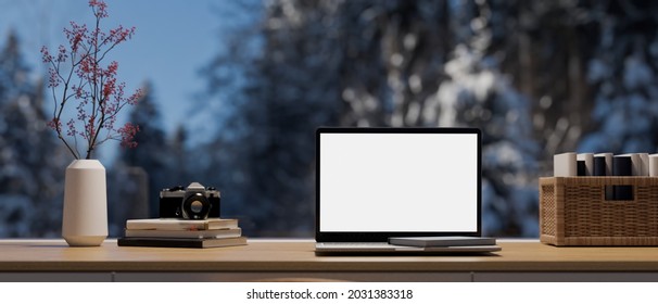 Closeup, Modern workspace with large window with nature view of winter season in background, laptop blank screen mockup on wood table and decorations, 3d rendering, 3d illustration