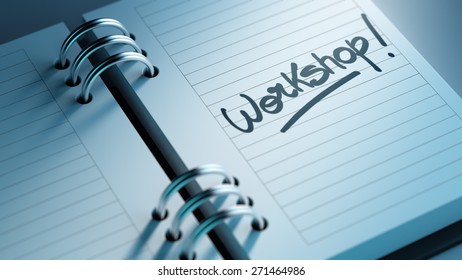 Closeup of a personal agenda setting an important date representing a time schedule. The words Workshop written on a white notebook to remind you an important appointment. - Powered by Shutterstock