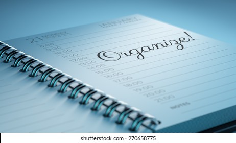 Closeup of a personal calendar setting an important date representing a time schedule. The words Organize written on a white notebook to remind you an important appointment.
