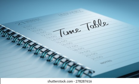 Closeup of a personal calendar setting an important date representing a time schedule. The words Timetable written on a white notebook to remind you an important appointment.