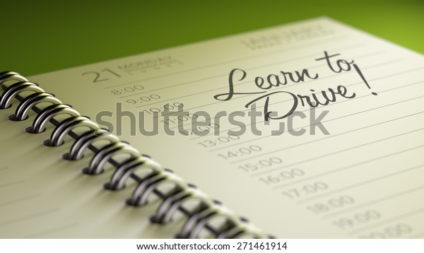 Closeup of a\
personal calendar setting an important date representing a time\
schedule. The words Learn to Drive written on a white notebook to\
remind you an important\
appointment.