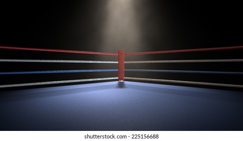 A closeup of the red corner of a regular boxing ring surrounded by ropes spotlit by a spotlight on an isolated dark background