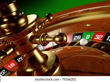 Closeup of a roulette wheel with the ball on the zero.