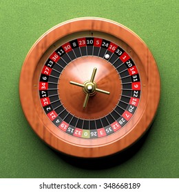 Close-up Of Roulette Wheel On Green Background.From Above