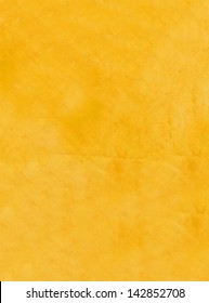 A Close-up Scan Of A Golden Yellow Rubber Background Texture.