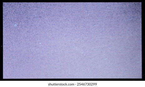 A close-up of the screen texture of an old VHS tape, with a blue color background and a grainy film effect. Photo overlay via blend mode.