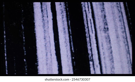 A close-up of the screen texture of an old VHS tape, with a blue color background and a grainy film effect. Photo overlay via blend mode.