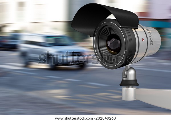 close-up of a\
security camera in city\
traffic