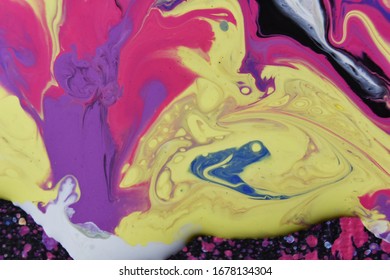 A closeup shot of a creative background with abstract acrylic painted colorful waves
