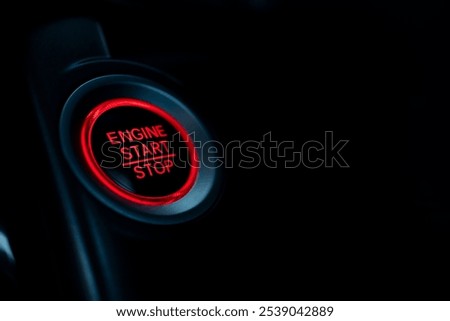 Closeup of start stop ignition button, highlighting modern car technology; sleek design and advanced functionality in vehicle dashboard for high-tech automotive interiors