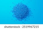 Closeup top view on blue plastic polypropylene granules heap centered on blue backdrop, masterbatch polymer grain pile. HDPE or PVC resin pellets. 3d render illustration. 3D Illustration