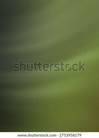 A close-up view of a gradient transitioning from dark gray to light green