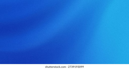 A close-up view of a textured fabric with a gradient of blue hues