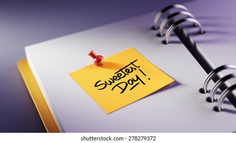 Closeup Yellow Sticky Note paste it in a notebook setting an appointment. The words Sweetest Day written on a white notebook to remind you an important appointment.