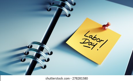 Closeup Yellow Sticky Note paste it in a notebook setting an appointment. The words Labor Day written on a white notebook to remind you an important appointment. - Powered by Shutterstock