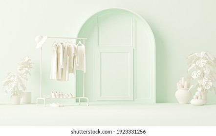 Clothes On Grunge Background, Shelf And Plants Pot On Pastel Green Background. Collection Of Clothes Hanging On A Rack In Neutral Cream Colors. 3d Rendering, Store And Bedroom Concept, Studio
