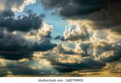 Cloudscape with sunbeams and shadows on a warm summer evening, with digital oil-painting effect, for themes of weather and formation, change, transience - Powered by Shutterstock - Get 15% off with code: PIKWIZARD15