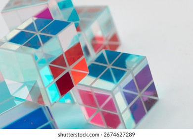 Cluster of transparent cubes with intersecting reflections in vivid blue, red, purple and green, forming a vibrant abstract design with geometric precision for creative, tech or visual branding use
