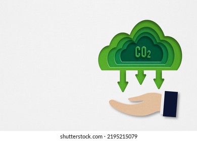 CO2 Emission, Green Industries Business Concept. Net Zero Emissions. Renewable Energy,  Ecology Solutions, Green CO2 Text Inside Cloud Paper Cut, 3D Illustration, Over Businessman's Hand