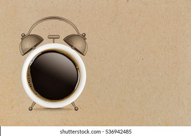 Coffee break concept. Coffe cup and sketch of alarm clock on cardboard background. - Powered by Shutterstock